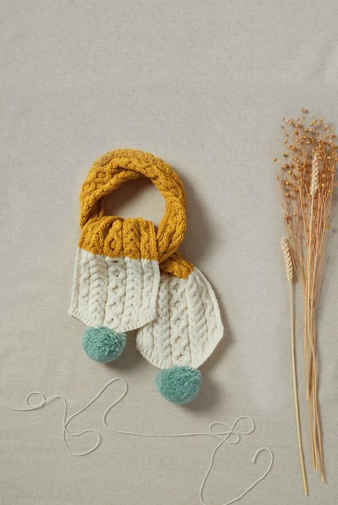 Siamsa Merino Aran Scarf with Pom Pom - Buí